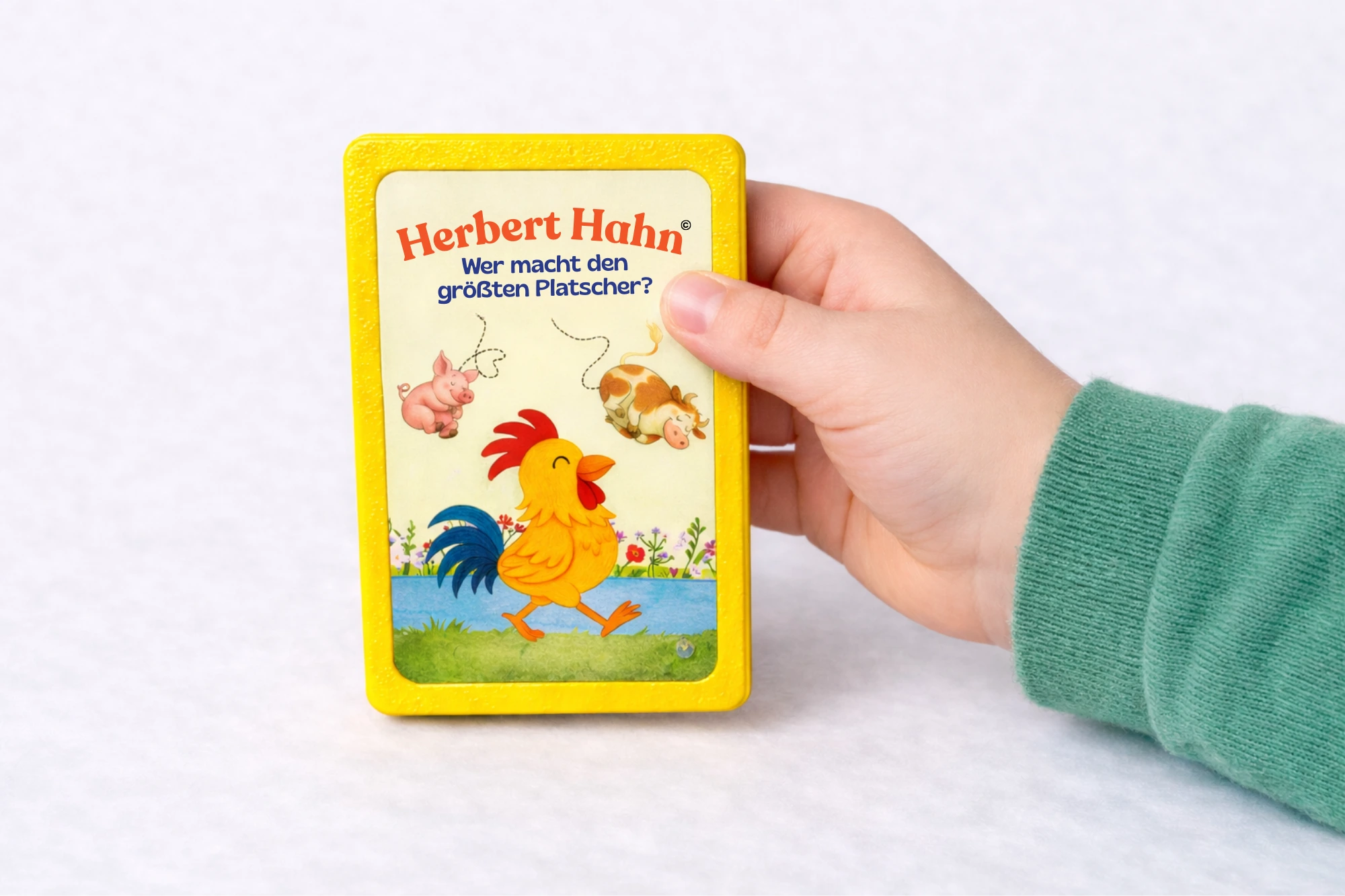 Hand h&auml;lt Fluxie Lesekarte